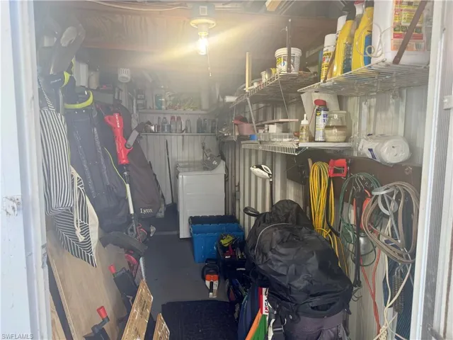 Storage room featuring washer / dryer