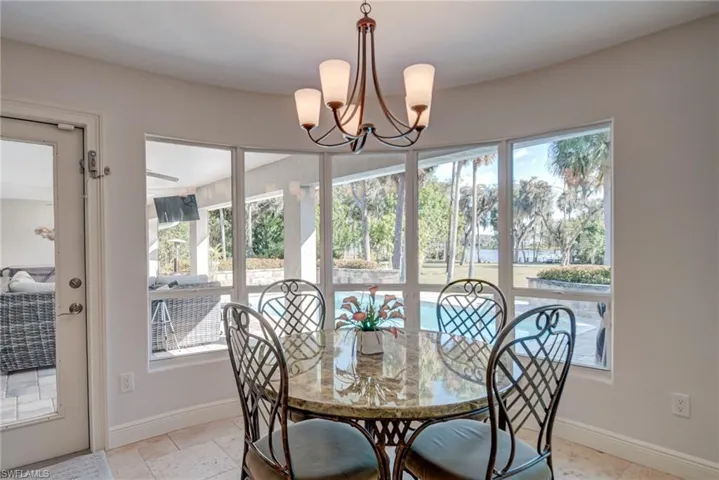 Lovely dining area overlooking the pool and river