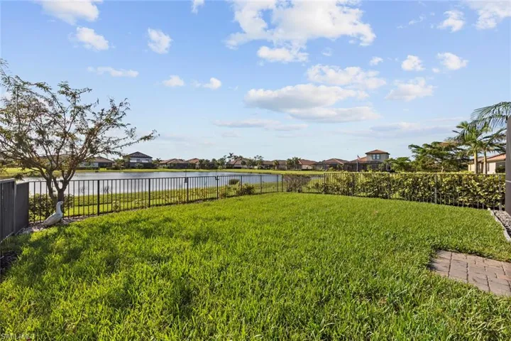 View of yard with a water view