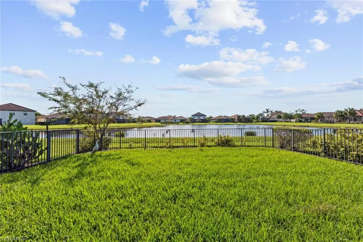 View of yard with a water view