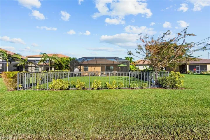 View of yard featuring glass enclosure