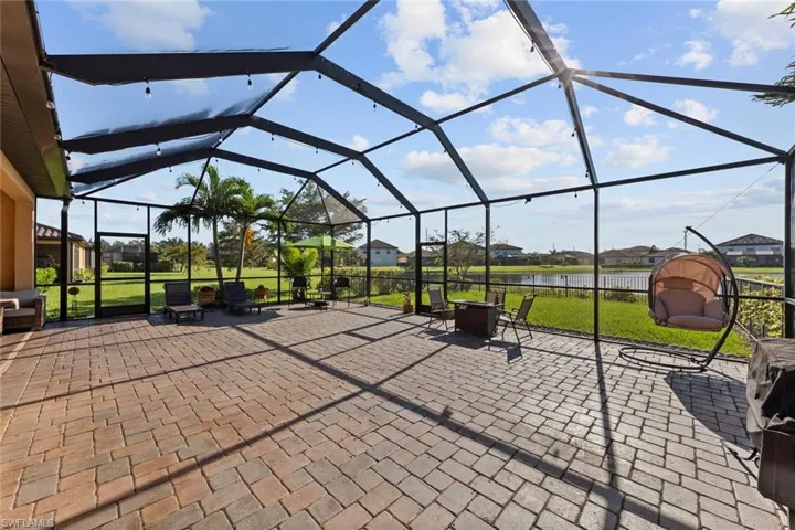 View of patio featuring glass enclosure