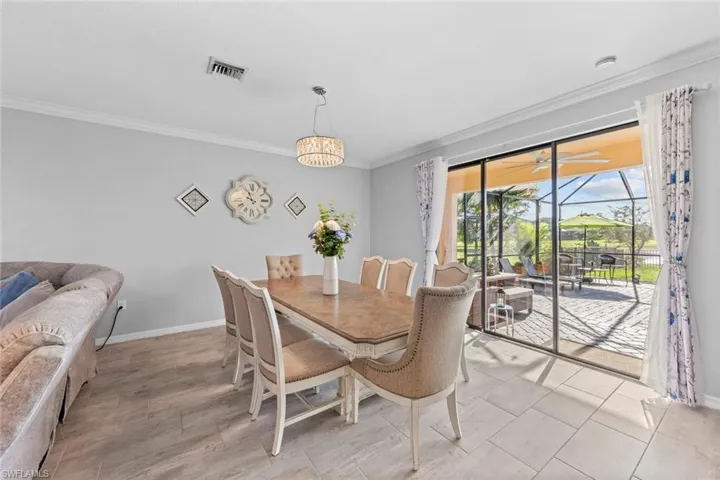 Dining space with ornamental molding