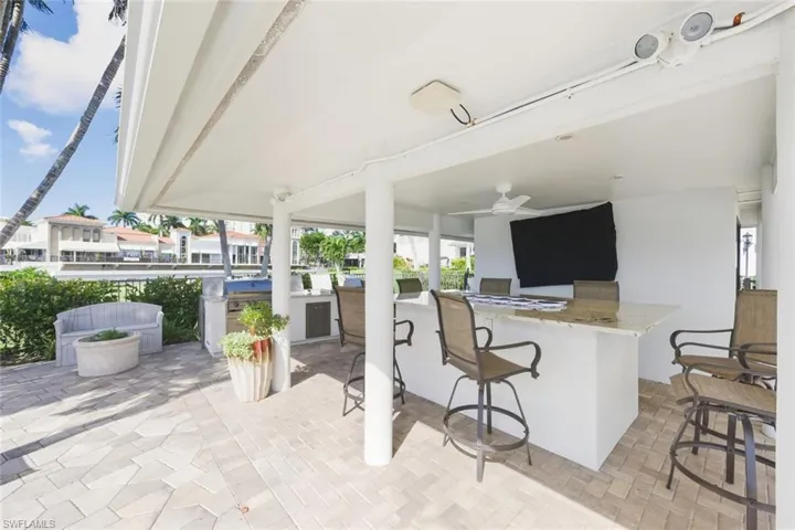 View of patio / terrace featuring area for grilling and ceiling fan