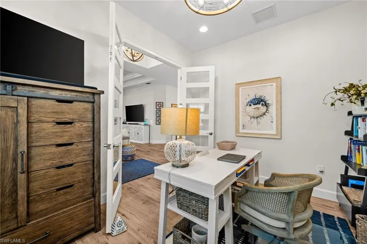 Office featuring light wood-style floors and recessed lighting