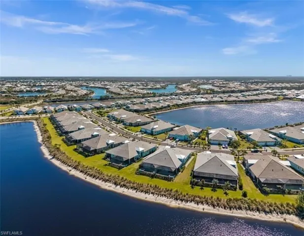 Aerial perspective of suburban area with a large body of water