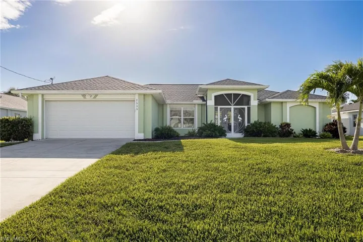 Ranch-style home with a garage and a front yard