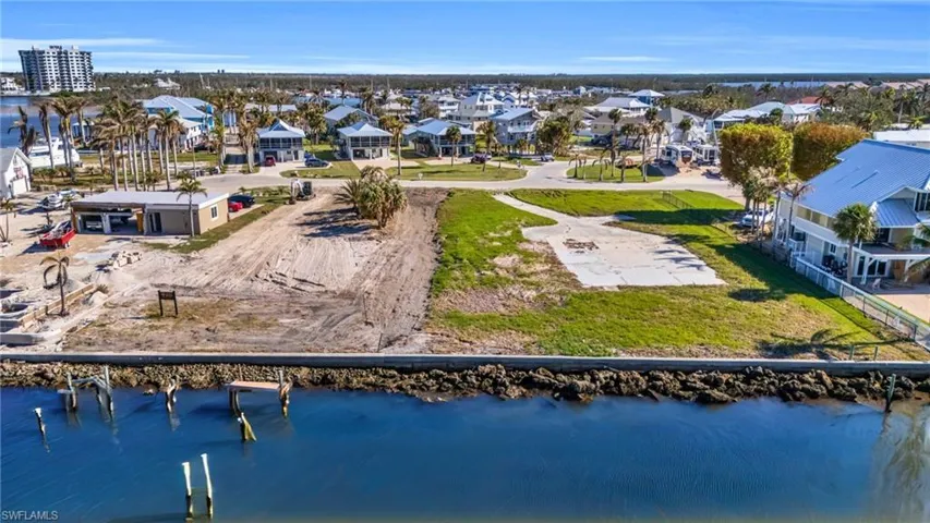 VIRTUALLY ENHANCED - Birds eye view of property featuring a water view