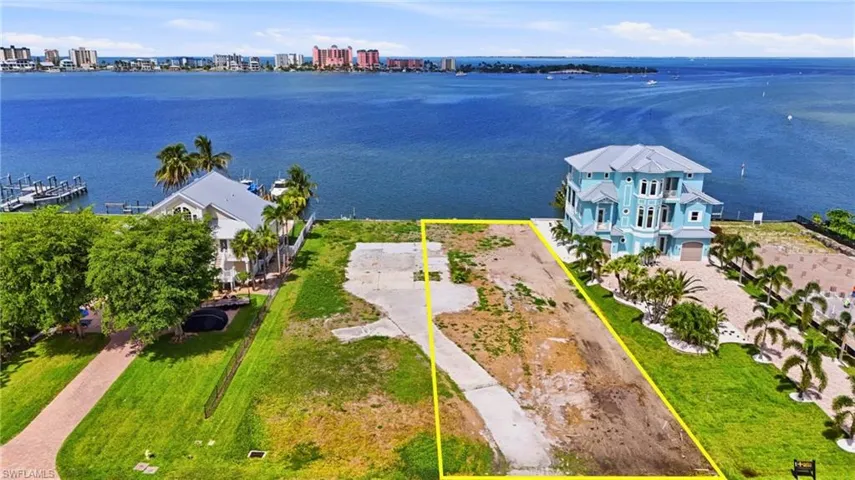Waterfront lot featuring a partially cleared building site and direct water access