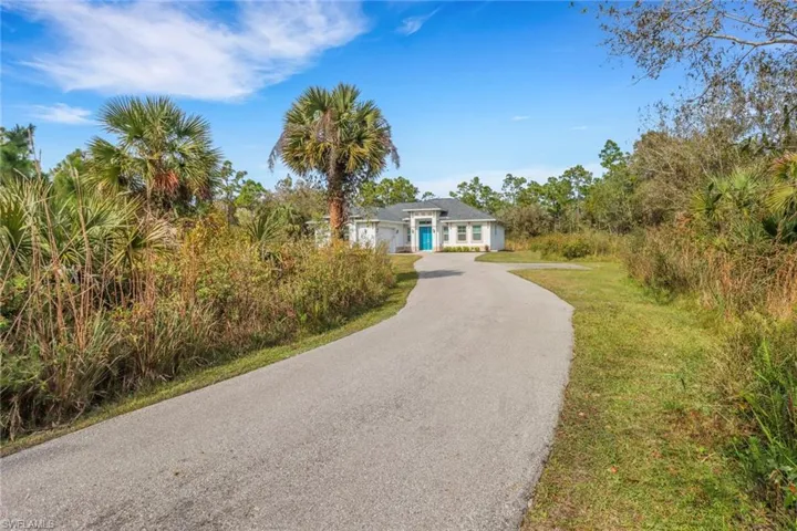 View of winding drive to house