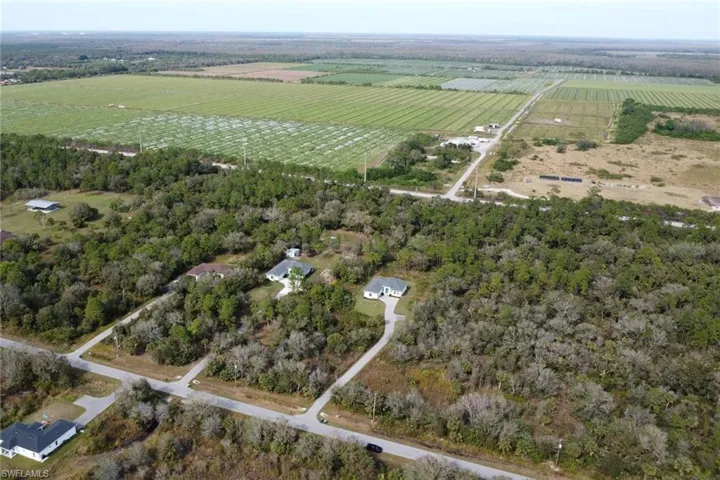 Birds eye view of property featuring a rural view