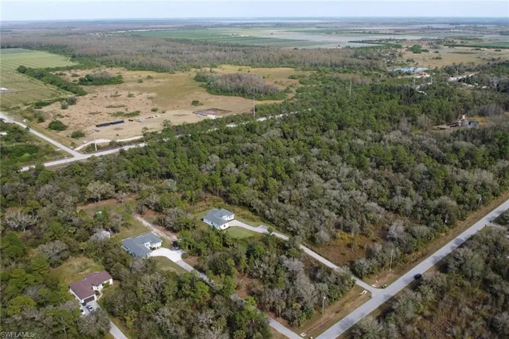 Birds eye view of property featuring a rural view
