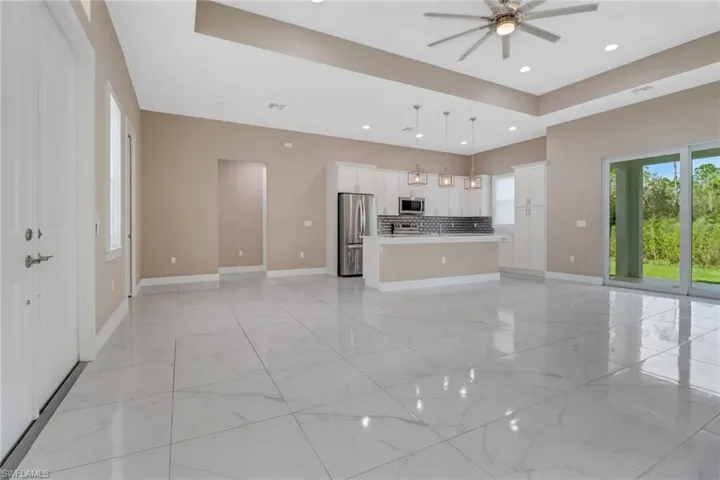 Tiled living area open to the upgraded kitchen