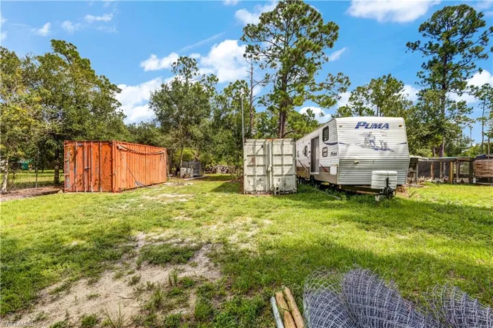 View of yard with a storage shed