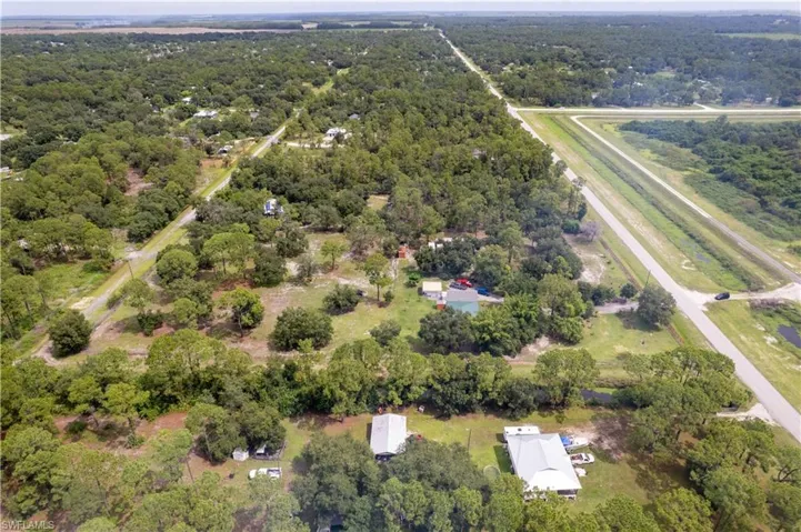 Aerial overview of property's location with a forest