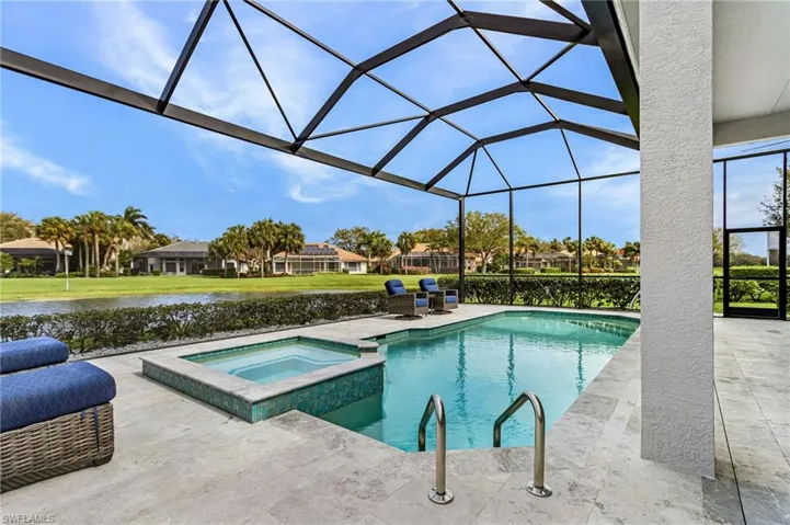 Expansive pool deck, fully screened lanai cage with Frameless Lake Views.