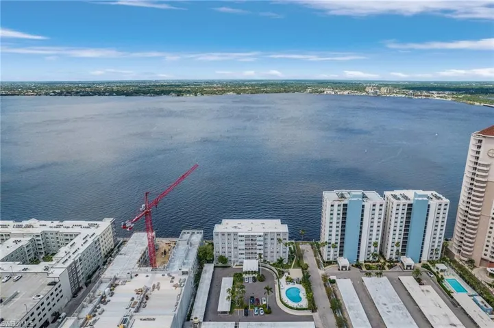 Drone / aerial view with a view of city and a water view