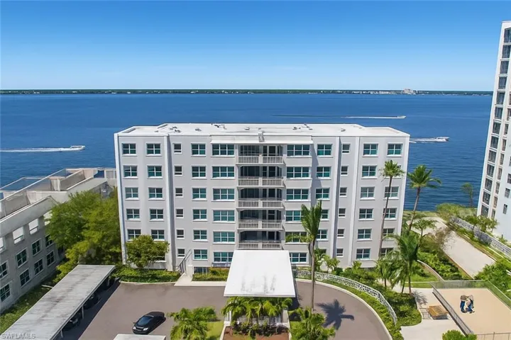 View of apartment building / complex with a water view