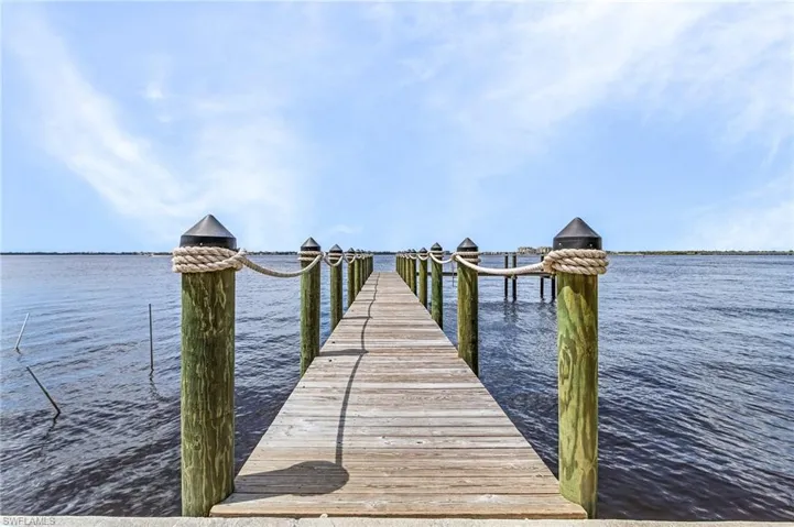 Dock area featuring a water view