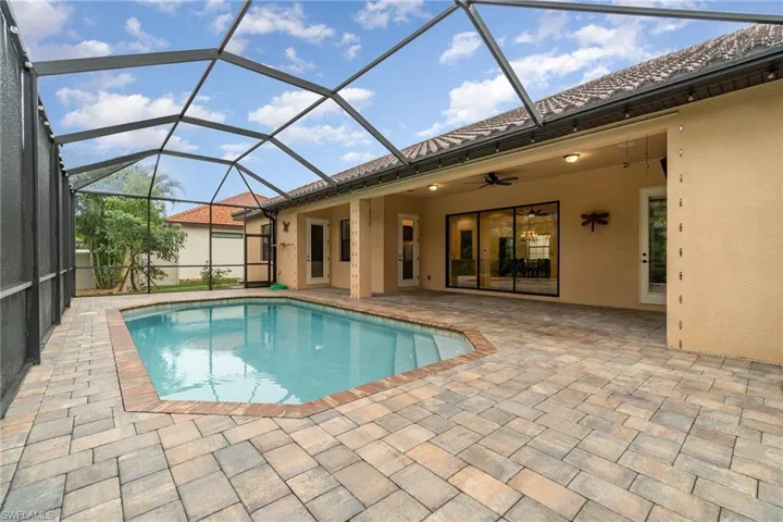 View of heated pool  Paver deck