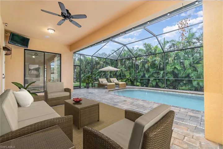 Virtually staged Lanai with pool and Enclosure