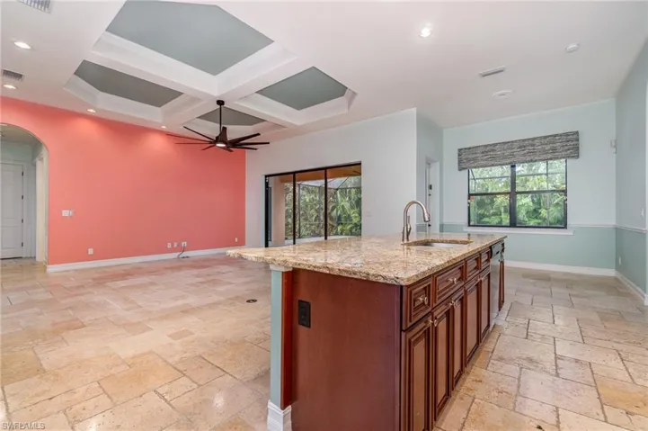 Kitchen Island overlooking family room  with beautiful ceiling detail