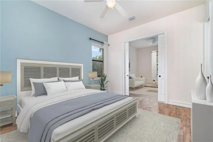 virtually staged Primary Bedroom 2  with sitting room thru pocket door