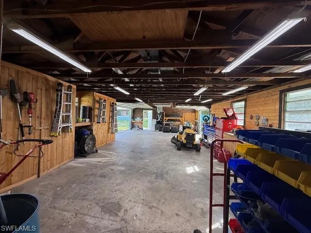 Garage featuring wooden walls