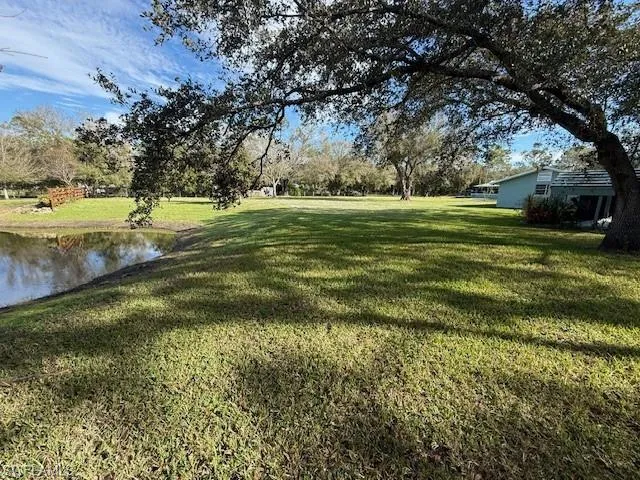 View of yard with a water view