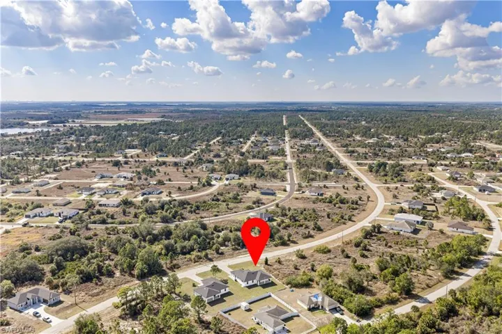 View of property location with nearby suburban area