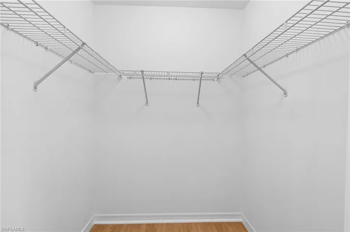 Walk in closet featuring light wood-type flooring