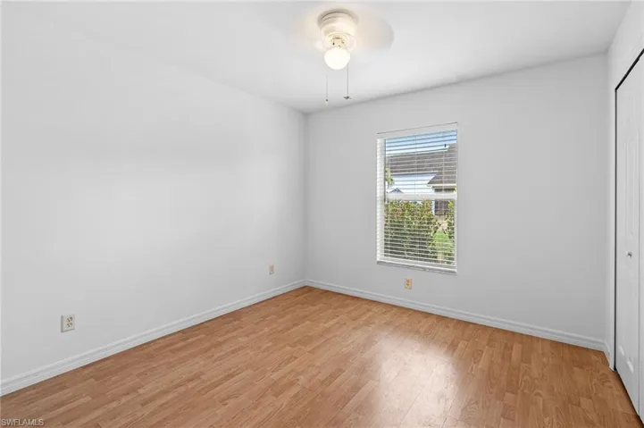 Unfurnished room with light wood finished floors and ceiling fan