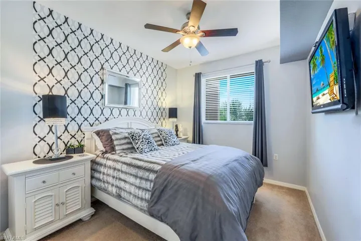 Guest Room is bright & has New, Grey-tone Carpet. (Stick-on wall covering easily removed)