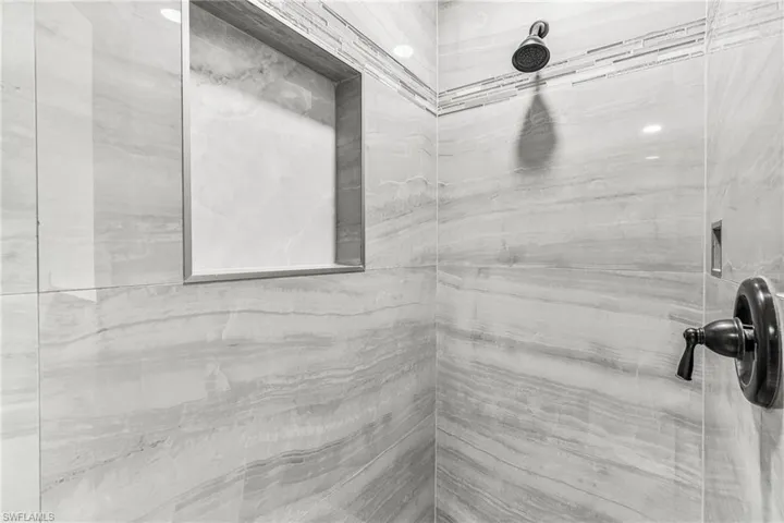 Bathroom with tiled shower