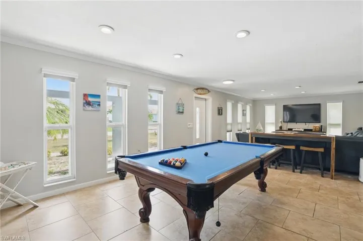 Game room featuring pool table, recessed lighting, and ornamental molding