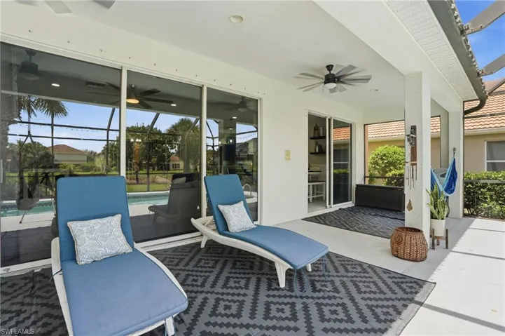 Covered patio featuring a ceiling fan, recessed lighting, and large sliding glass doors