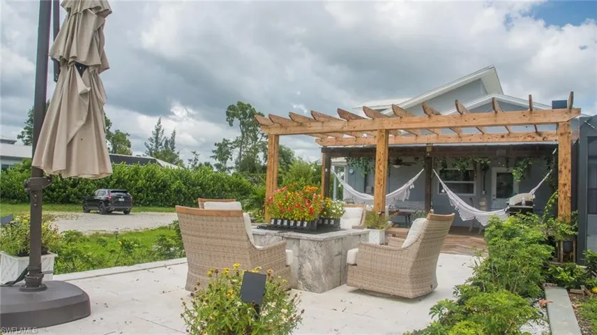 View of patio with a pergola and ceiling fan