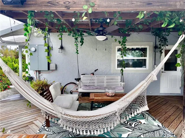 Wooden deck featuring a ceiling fan