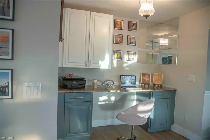 Office featuring wood finished floors and baseboards