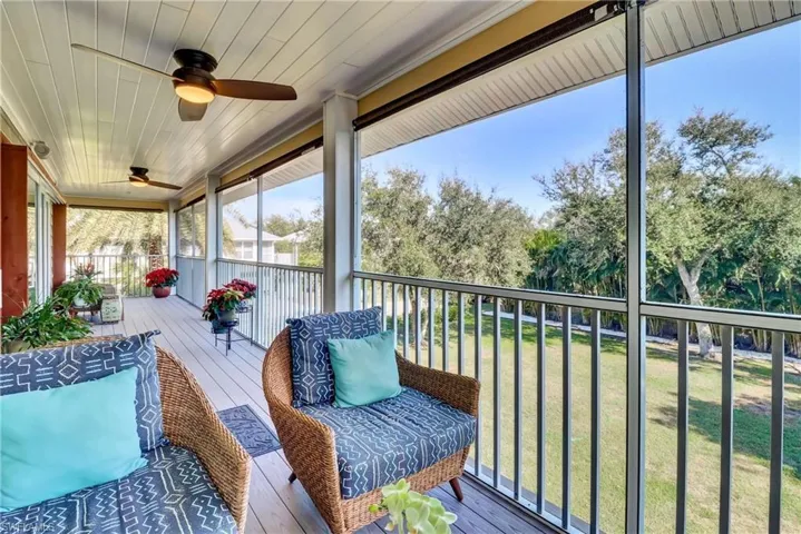 Sunroom with a ceiling fan
