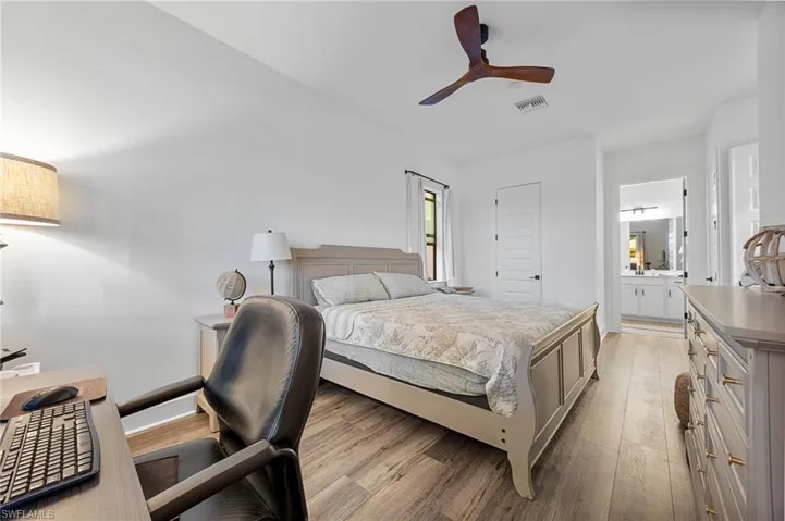 Bedroom with light wood finished floors and ceiling fan