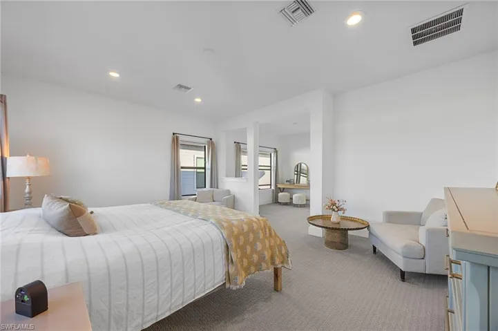 Carpeted bedroom featuring recessed lighting