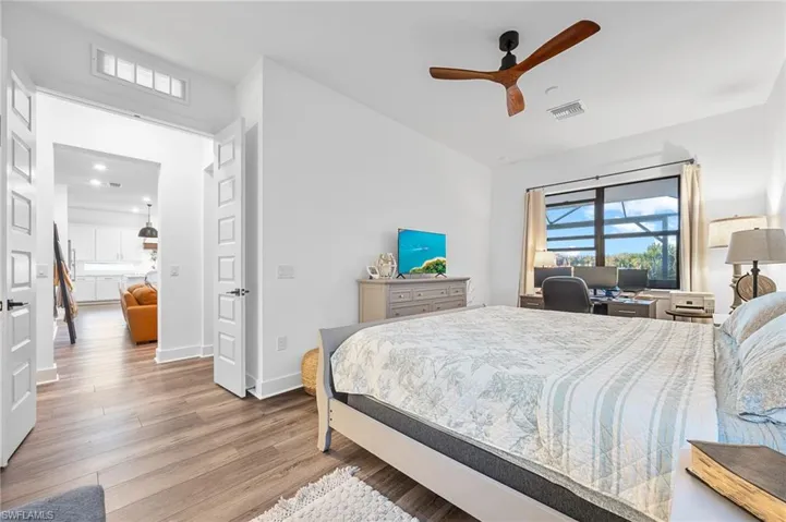 Bedroom with light wood-type flooring and ceiling fan