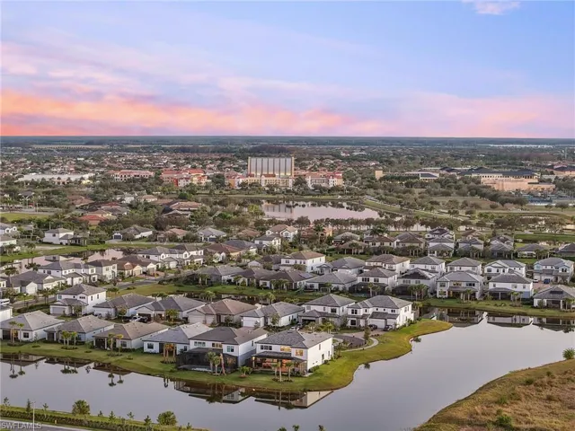 Aerial view at dusk of a residential view and a water view