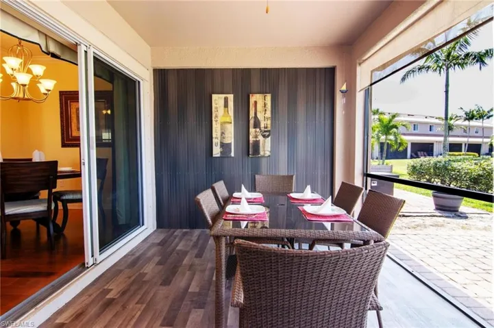 Attractive slider to screened under truss lanai for enjoyable outdoor dining.