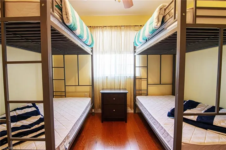 Sunlit front third bedroom with bunk beds