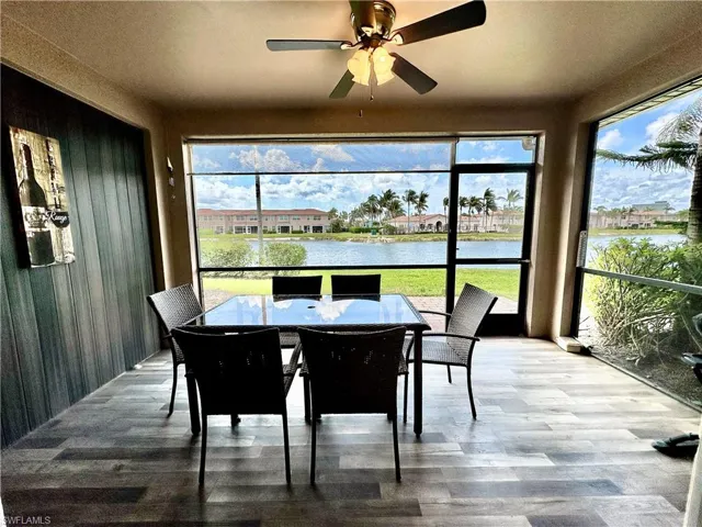 Attractive tiled screened lanai under truss viewing lake