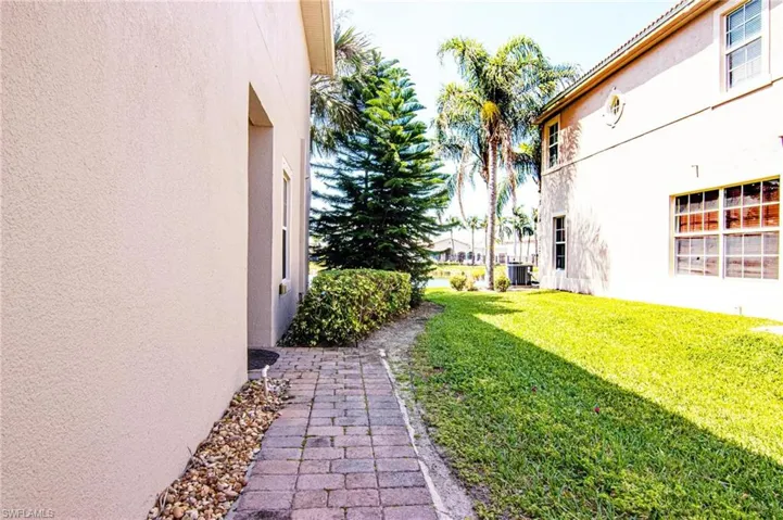 Paver side walkway to condo entry door.