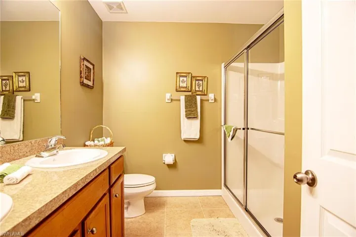 Upstairs Master bath with slider shower and linen closet
