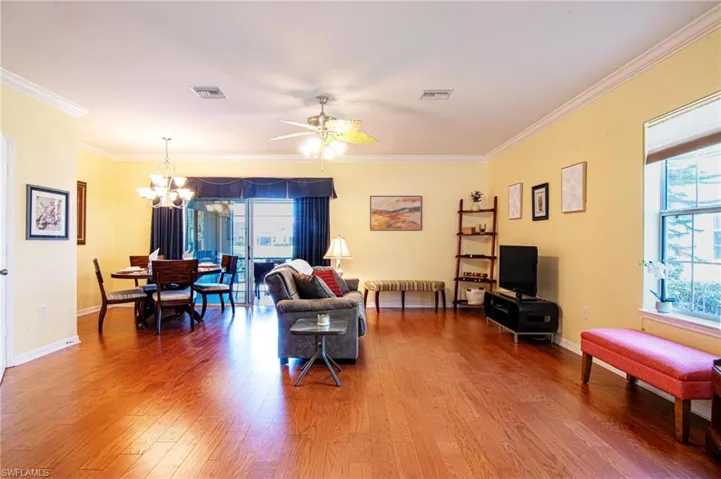 Greatroom view of living room and formal dining from entry to lanai slider